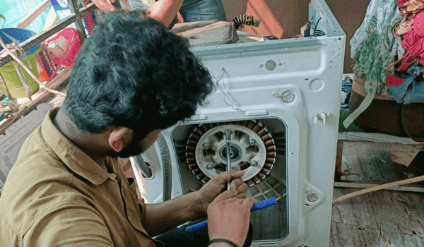 Washing machine repairing services by revamp Services